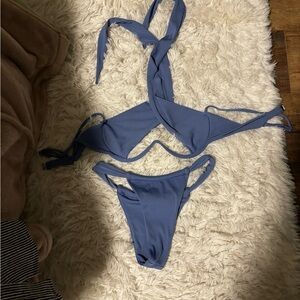 Blue, cross over under boob.